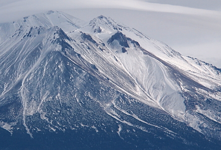 [This closer view of the side of the mountain makes it appear there is a sheet of ice covering all that can be seen -- snow and rock.]